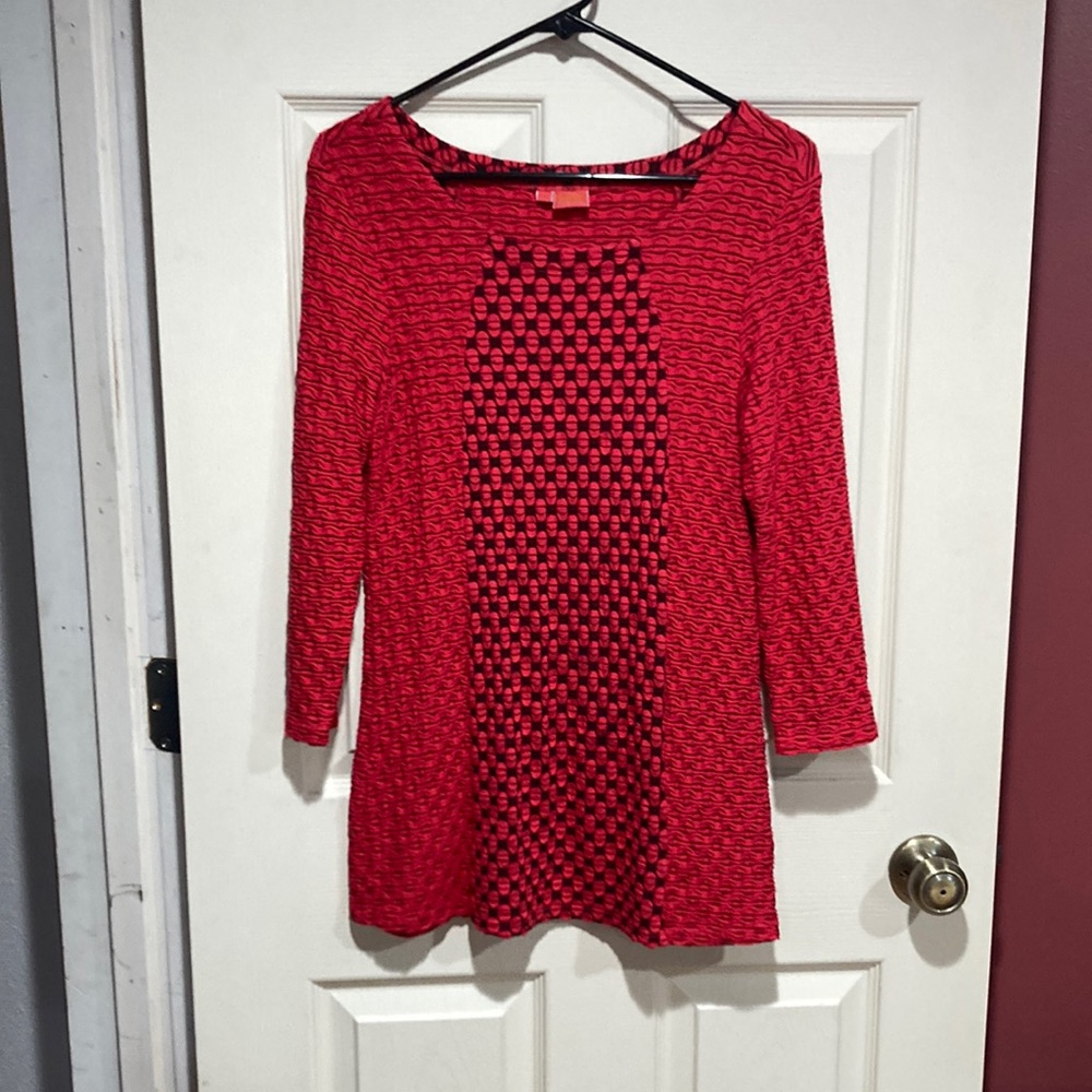 Tianello by Steve Barraza.  Long lightweight sweater that looks great w/tight.